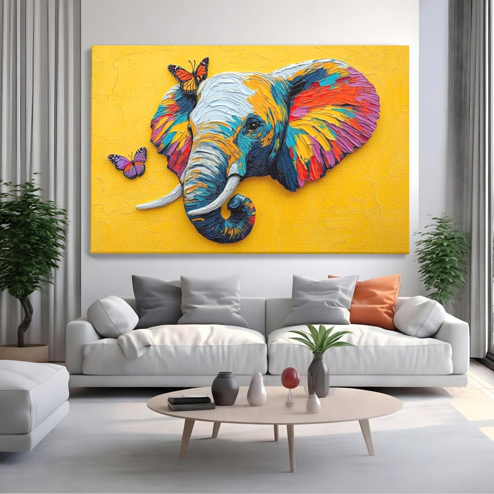 Tablou canvas cu tablou canvas cu elefant colorat si fluturi, fara rama, pe sasiu de lemn, pe perete intr-un living